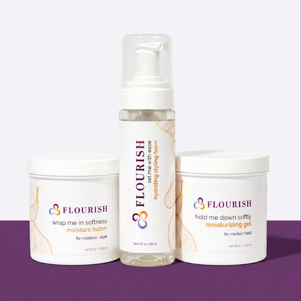Three bottles of hair care products on a purple and white background