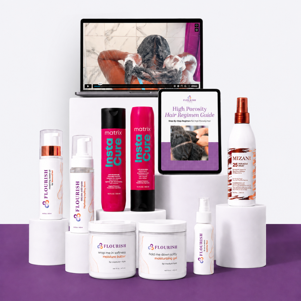 A curated collection of hair care products from Flourish and Mizani arranged on white display blocks against a split white and purple studio background. Visible items include a black hairbrush, white jars and bottles, a white spray bottle, a white bottle with a copper cap and Mizani label, a tablet showing a hair care video, and a printed guide titled 'High Porosity Hair Braid Guide'.